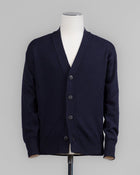 Super Geelong wool cardigan featuring dropped shoulder and 4-button closure. Versatile and refined, it's a timeless wardrobe staple. For its unparalleled softness, this item is a luxury treat. Made in Italy.

Article: 23188/25051
Color: 598 / Navy
Composition: 100% Virgin Wool
Super Geelong
Made in Italy Gran Sasso Wool Cardigan / Navy