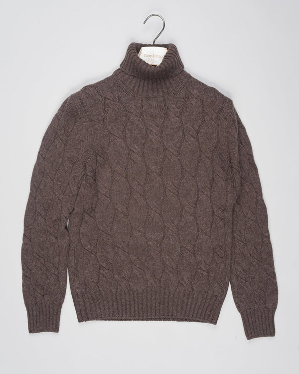 Classic version of a heavy roll neck with a beautiful knitted cable pattern. Warm and comfortable for the cold season.

Article: 13115/19659
Color: 184 / Brown
Composition: 80% Virgin Wool 10% Cashmere 10% Viscose

Made in Italy Gran Sasso Cable Knit Roll Neck / Brown