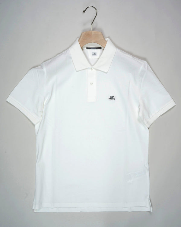 Regular fit polo shirt cut in a short sleeve construction with a two button placket, a classic collar, and the C.P. Company logo on the chest. Made in a fine 24/1 cotton pique, and resist dyed for a varied, tonal finish. Art. PL094A5263W 005263W Col. 103 Gauze White Classic collar Two button placket Logo detail Short sleeves Resist dyed Regular fit 