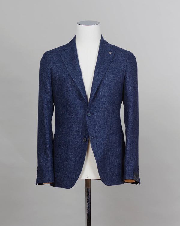 Composition: 58% Virgin Wool 42% Linen Modello: 1SMC22K Article: 470001U Color: I358 Blue Slim fit. Take your normal size Unlined Unconstructed shoulder  2 Buttons Side vents Notch lapel Patch pockets Made in Italy